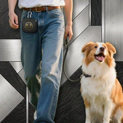 K9 Forge dog treat training pouch clipped to belt – man walking Border Collie outdoors with hands-free treat bag